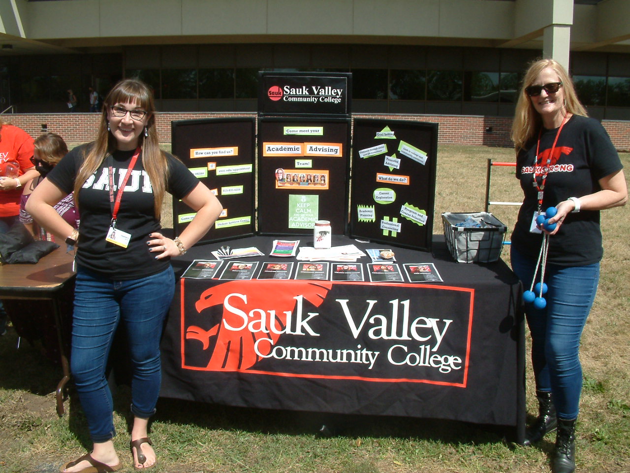 Academic-advisor-Stephanie-Jacobs-academic-counselor-Valerie-Kern-Lyons-stand-in-front-of-the-SVCC-academic-advising-booth.JPG