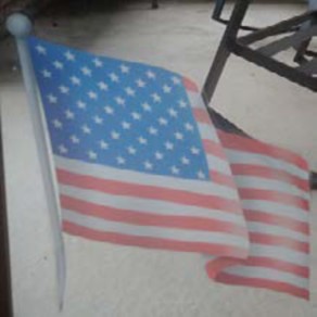 An American flag is shown to honor an American hero.