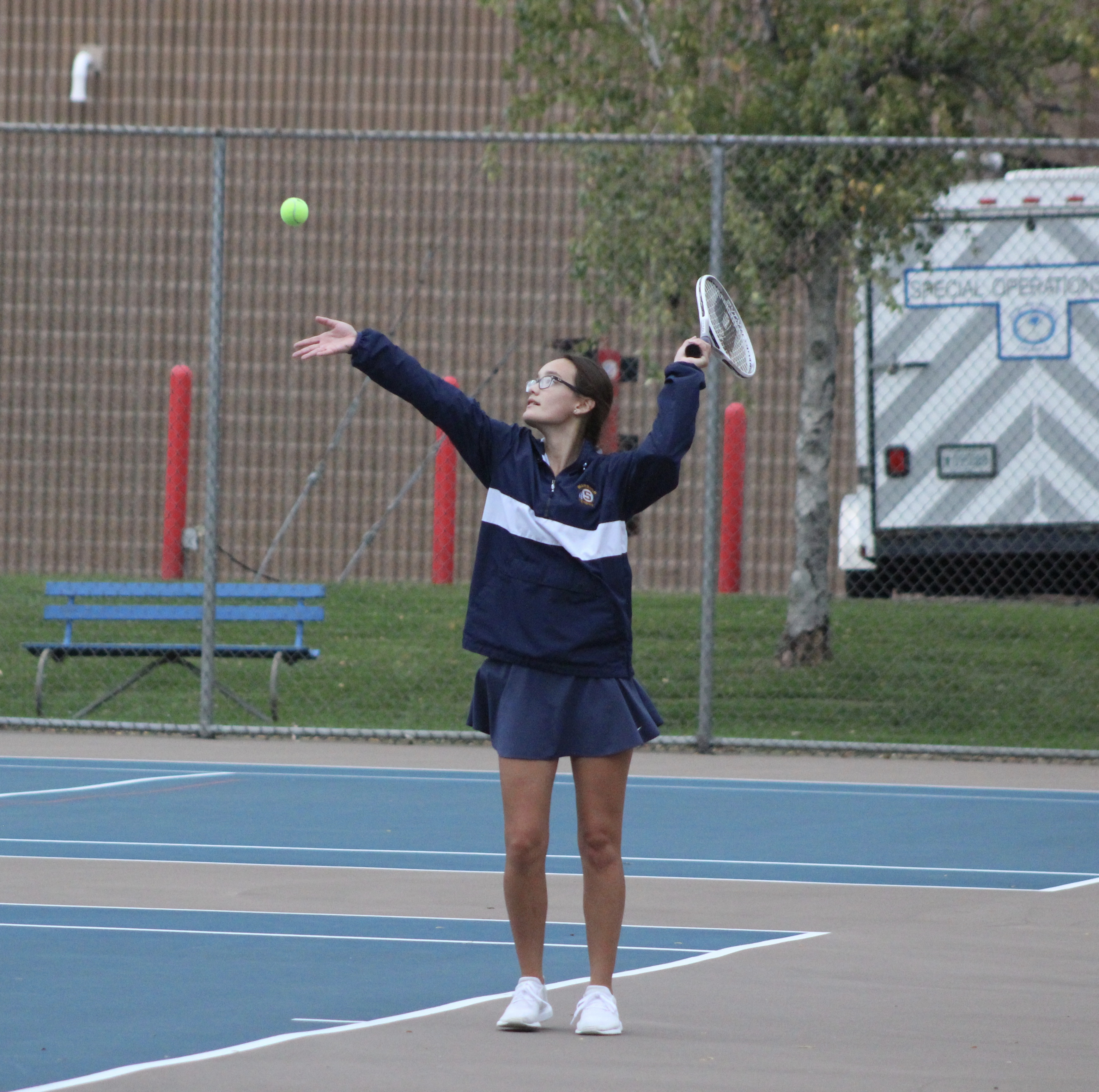 Kaylee Martinez serves to Taylor Harrison