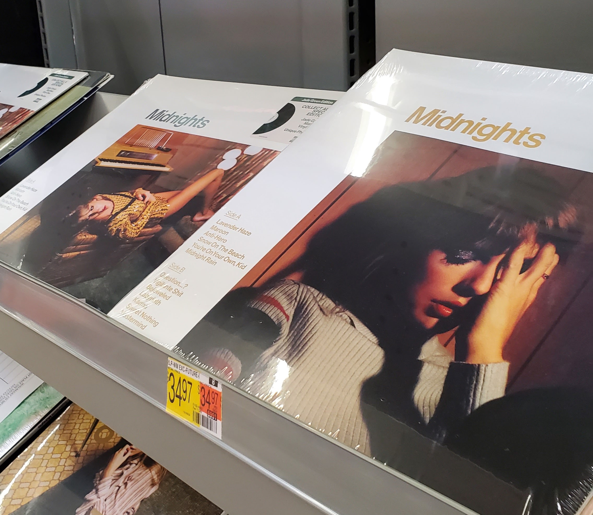 Different editions of Taylor Swift's Midnight vinyl albums on display