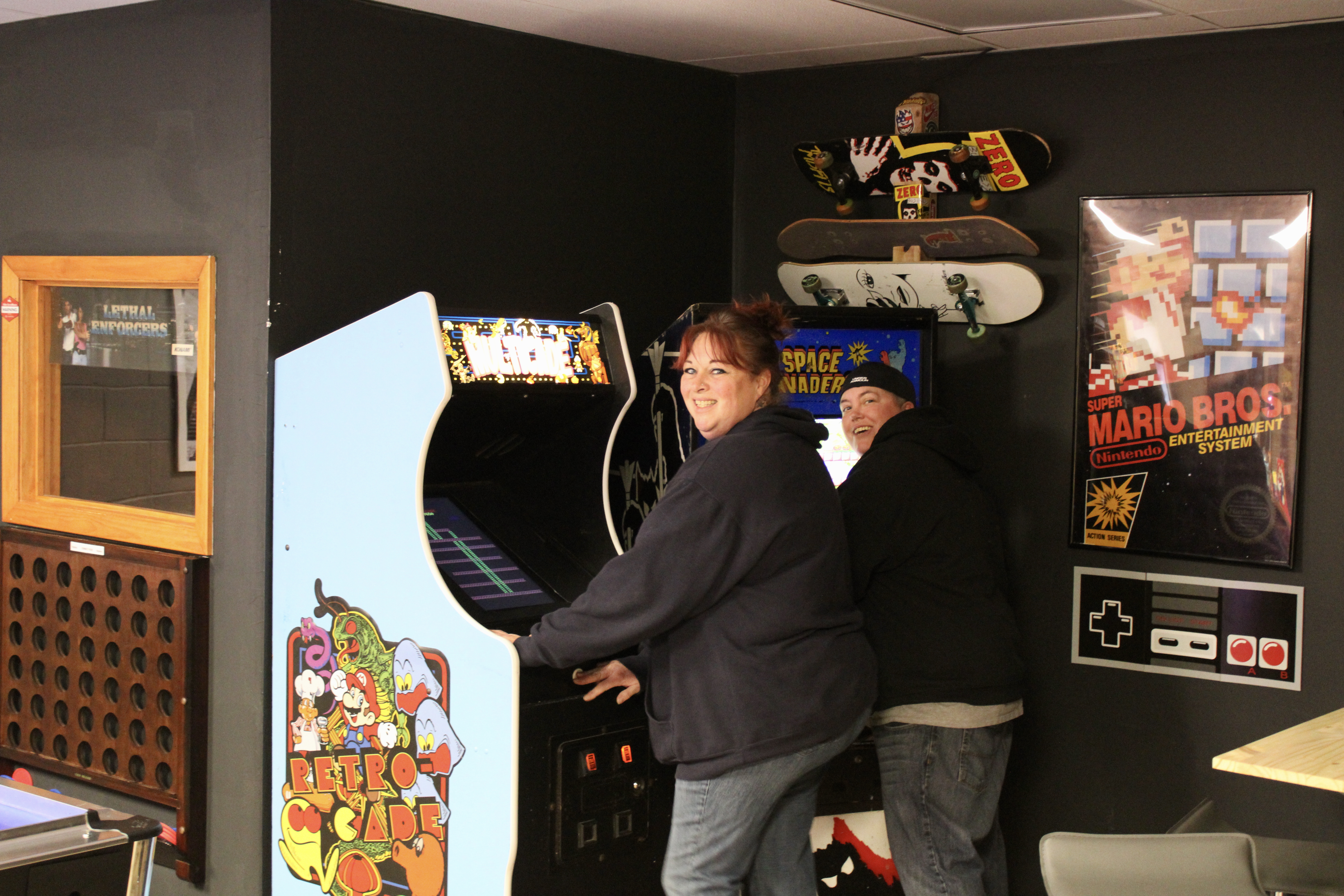 Customers enjoying some retro games.