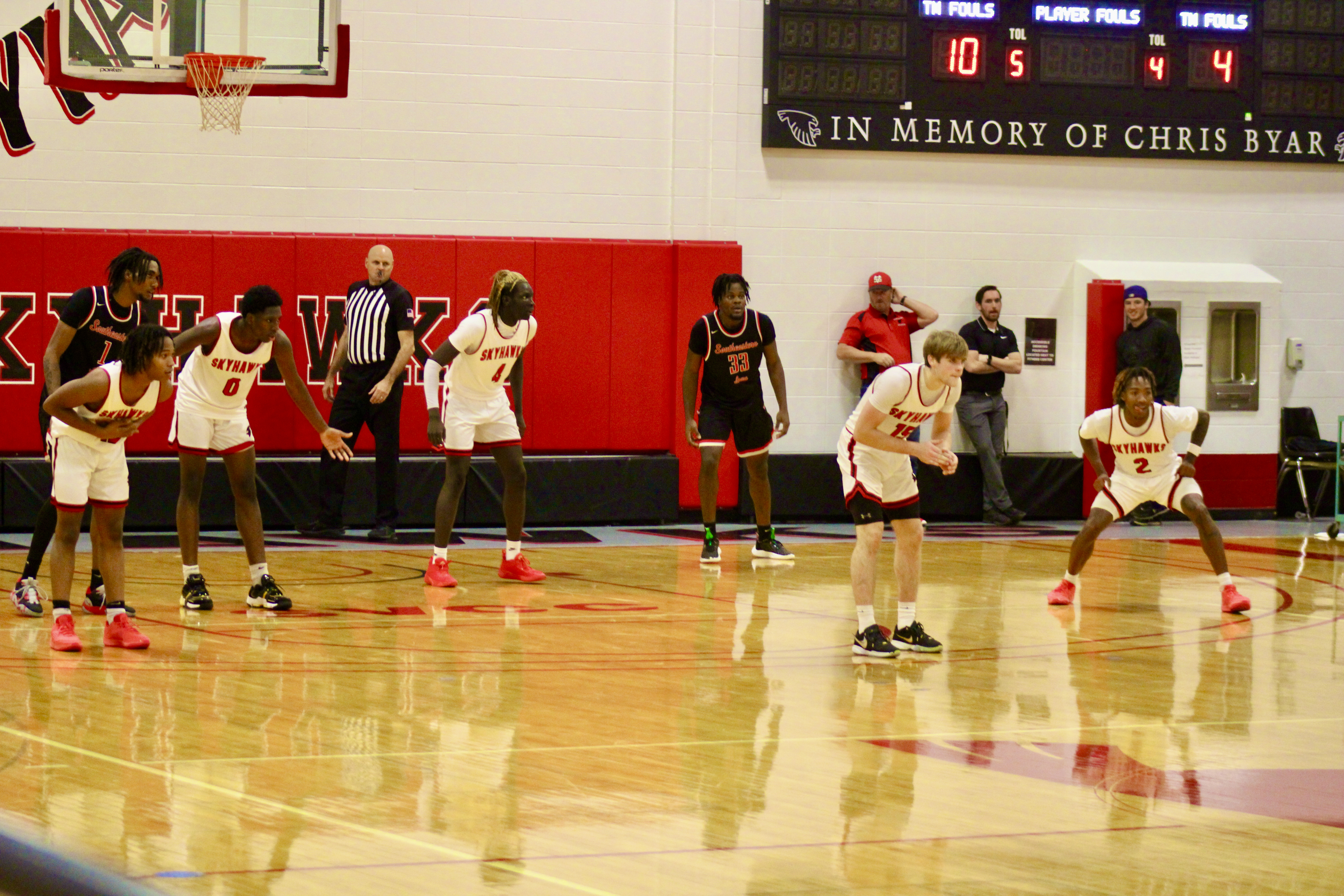 The Skyhawks on the court in a defensive formation