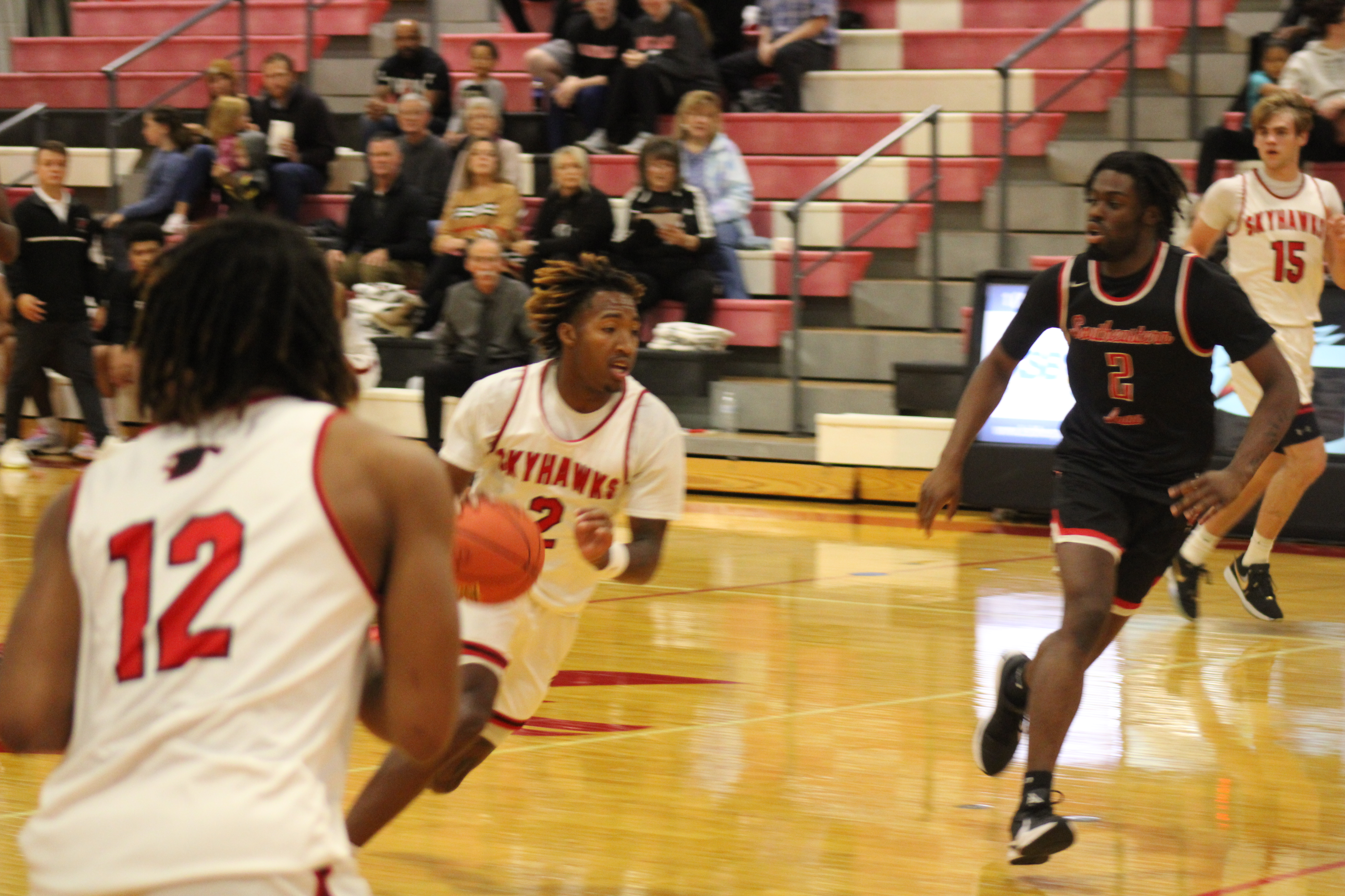 Guard LA Fayne attacks the basket following a transition steal